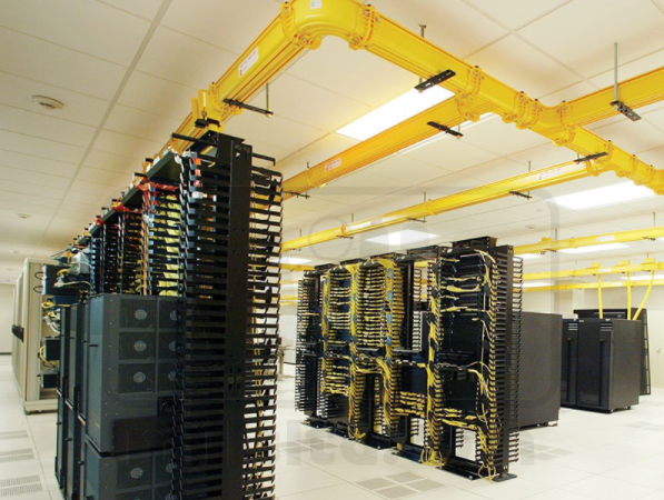 yellow fiber runner cable basket running over racks in data center